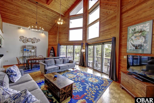 50050 Bayside Ct Lot 30, Frisco, NC 27936 - living area featuring high vaulted ceiling, wooden walls, wood ceiling with exposed beams, and a chandelier