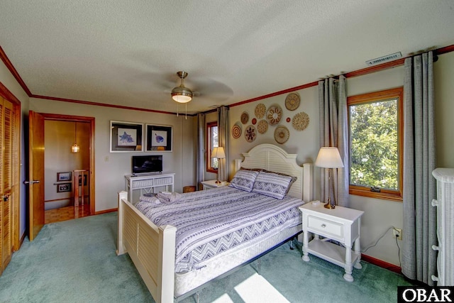 50050 Bayside Ct Lot 30, Frisco, NC 27936 - carpeted bedroom with a textured ceiling, baseboards, crown molding, and a ceiling fan