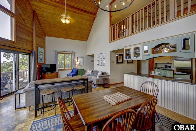 50050 Bayside Ct Lot 30, Frisco, NC 27936 - dining area featuring high vaulted ceiling, baseboards, wooden ceiling, a chandelier, and ceiling fan