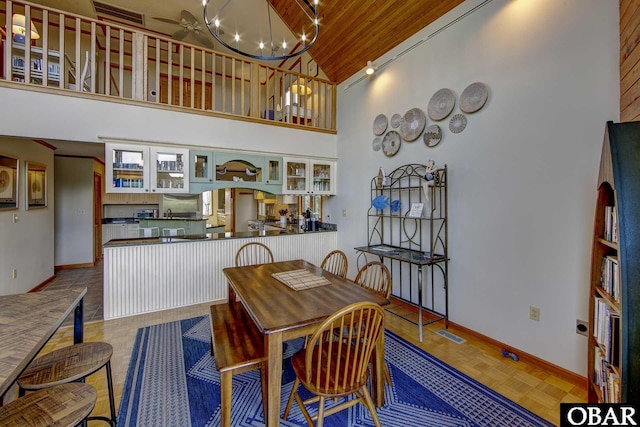 50050 Bayside Ct Lot 30, Frisco, NC 27936 - dining space with high vaulted ceiling, baseboards, a chandelier, and wood ceiling