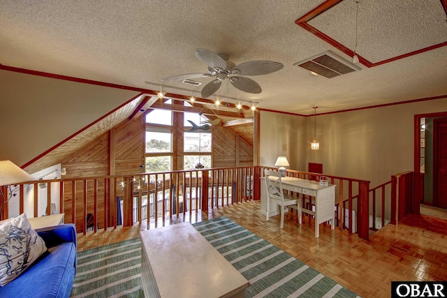 50050 Bayside Ct Lot 30, Frisco, NC 27936 - living area with a ceiling fan, a textured ceiling, an upstairs landing, ornamental molding, and a chandelier