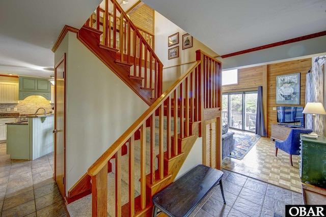 50050 Bayside Ct Lot 30, Frisco, NC 27936 - staircase with stone tile floors, crown molding, and baseboards