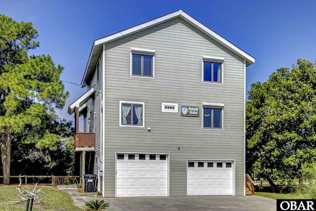 50050 Bayside Ct Lot 30, Frisco, NC 27936 - view of property exterior featuring a garage and concrete driveway