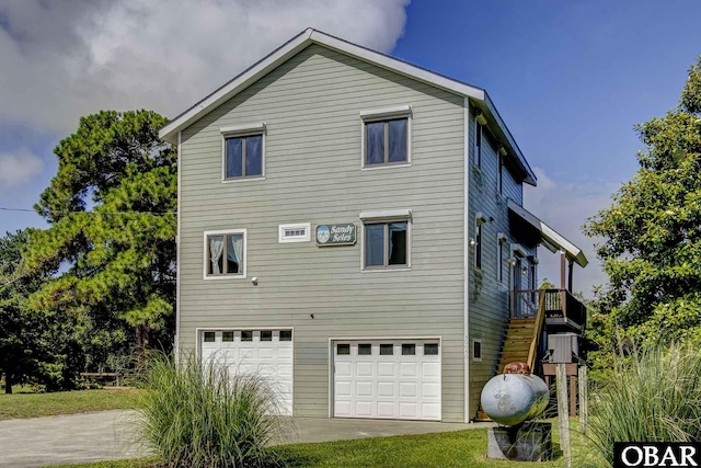 50050 Bayside Ct Lot 30, Frisco, NC 27936 - view of side of home with an attached garage, driveway, and stairs