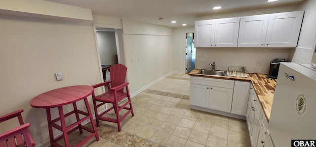 4327 S Hammerhead Dr Lot # 37, Nags Head, NC 27959 - kitchen featuring a sink, wood counters, decorative backsplash, recessed lighting, and white cabinetry