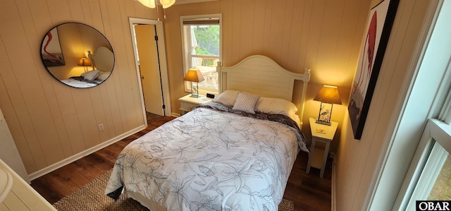 4327 S Hammerhead Dr Lot # 37, Nags Head, NC 27959 - bedroom featuring dark wood-style floors, baseboards, and wood walls