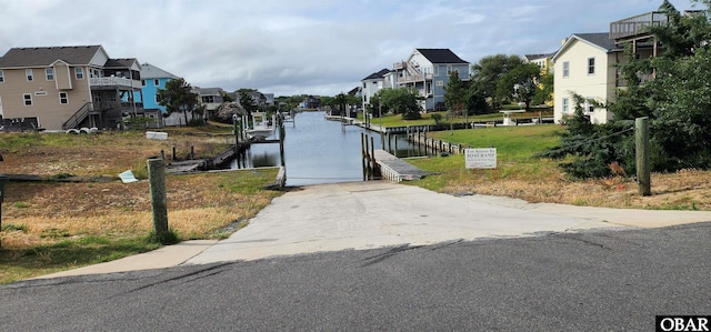 4327 S Hammerhead Dr Lot # 37, Nags Head, NC 27959 - view of asphalt road with a boat ramp, a residential view, and a water view