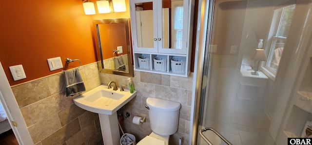 4327 S Hammerhead Dr Lot # 37, Nags Head, NC 27959 - full bathroom with tile walls, a shower stall, toilet, and wainscoting