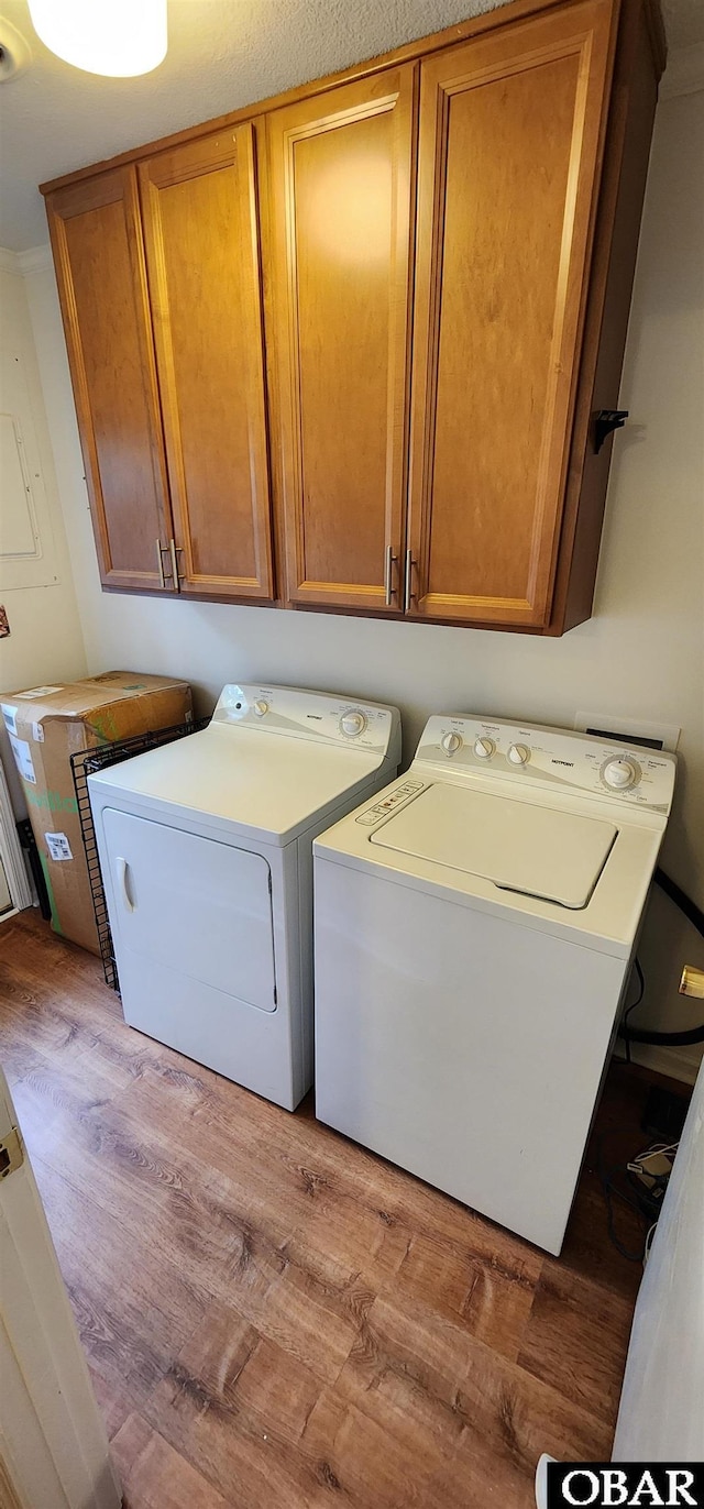 4327 S Hammerhead Dr Lot # 37, Nags Head, NC 27959 - laundry area featuring separate washer and dryer, wood finished floors, and cabinet space