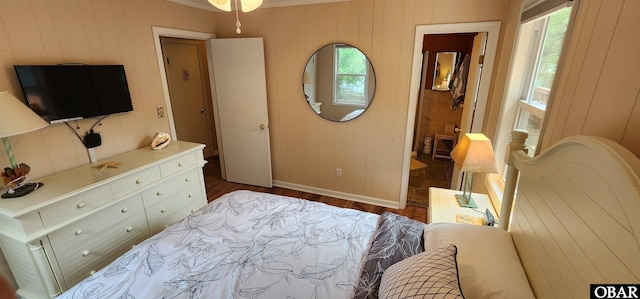 4327 S Hammerhead Dr Lot # 37, Nags Head, NC 27959 - bedroom featuring baseboards, wood finished floors, wood walls, and crown molding