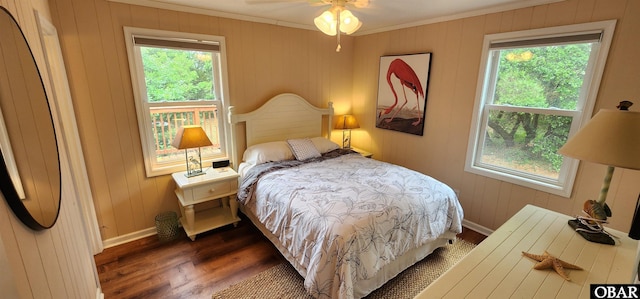 4327 S Hammerhead Dr Lot # 37, Nags Head, NC 27959 - bedroom featuring crown molding, multiple windows, dark wood-style flooring, baseboards, and wood walls