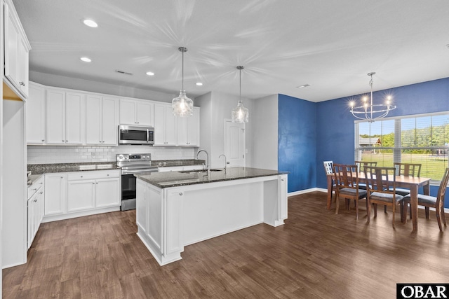115 Sligo Way Lot 10, Moyock, NC 27958 - kitchen with appliances with stainless steel finishes, a chandelier, dark wood finished floors, recessed lighting, and backsplash