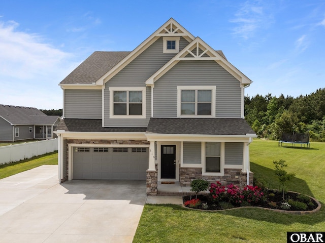 115 Sligo Way Lot 10, Moyock, NC 27958 - craftsman house featuring driveway, an attached garage, a trampoline, a porch, and a shingled roof
