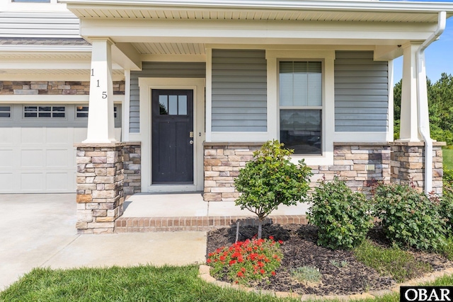 115 Sligo Way Lot 10, Moyock, NC 27958 - doorway to property with a porch, stone siding, and driveway