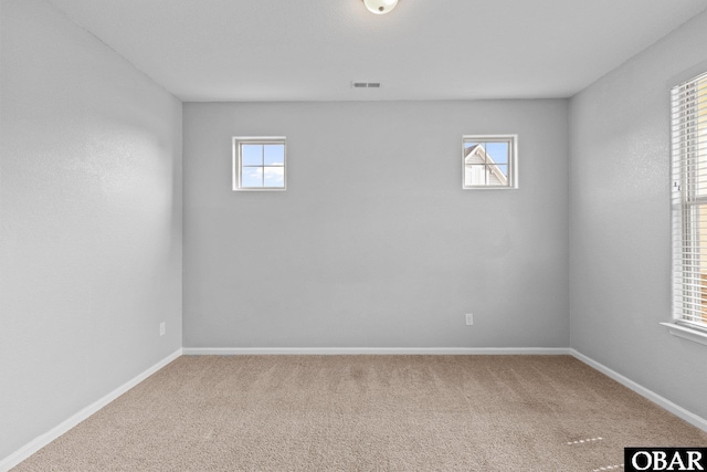 115 Sligo Way Lot 10, Moyock, NC 27958 - empty room featuring healthy amount of natural light and carpet flooring