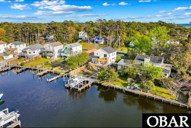 aerial view featuring a water view and a view of trees