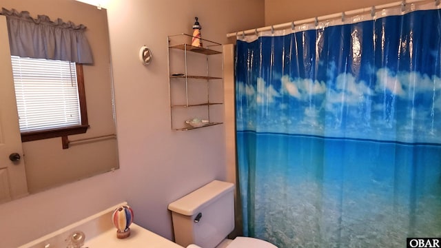 1809 Apache St Lot 3, Kill Devil Hills, NC 27948 - bathroom with toilet and a shower with shower curtain