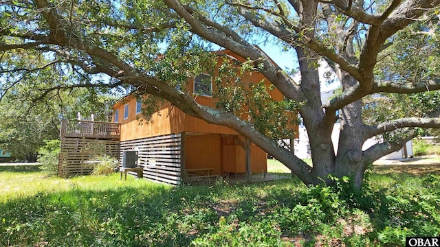 1809 Apache St Lot 3, Kill Devil Hills, NC 27948 - view of side of home featuring a wooden deck and central AC unit