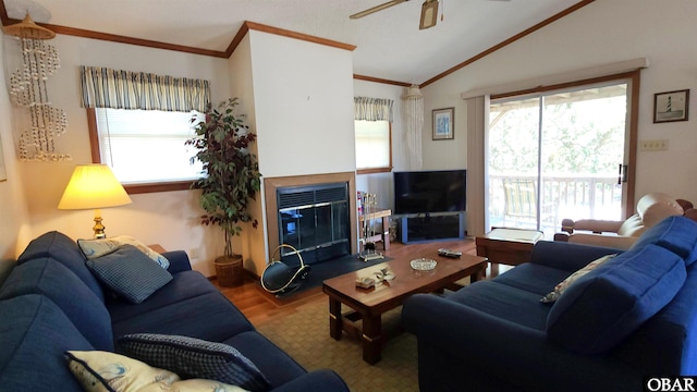 1809 Apache St Lot 3, Kill Devil Hills, NC 27948 - living area with lofted ceiling, ornamental molding, wood finished floors, a ceiling fan, and a glass covered fireplace