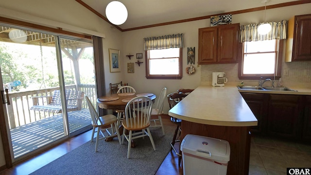 1809 Apache St Lot 3, Kill Devil Hills, NC 27948 - kitchen featuring a sink, lofted ceiling, plenty of natural light, light countertops, and a peninsula