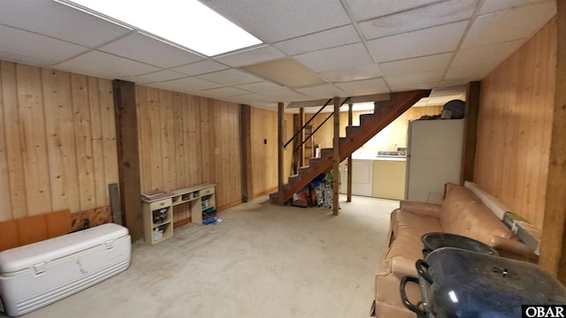 1809 Apache St Lot 3, Kill Devil Hills, NC 27948 - finished below grade area featuring wood walls, freestanding refrigerator, washer and dryer, stairway, and a paneled ceiling