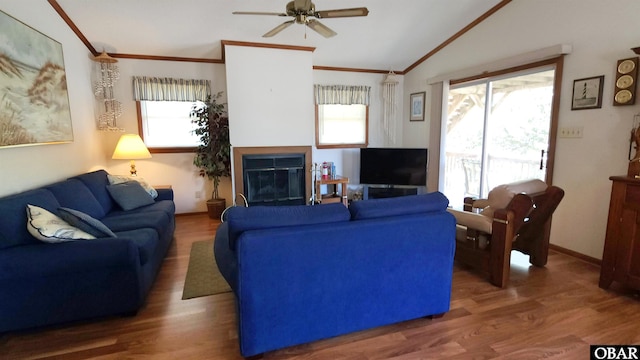 1809 Apache St Lot 3, Kill Devil Hills, NC 27948 - living area with ceiling fan, crown molding, vaulted ceiling, wood finished floors, and a glass covered fireplace