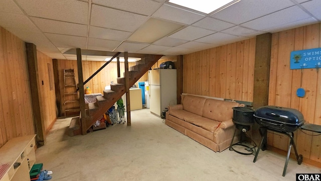 1809 Apache St Lot 3, Kill Devil Hills, NC 27948 - finished below grade area featuring freestanding refrigerator, wood walls, stairs, and a drop ceiling