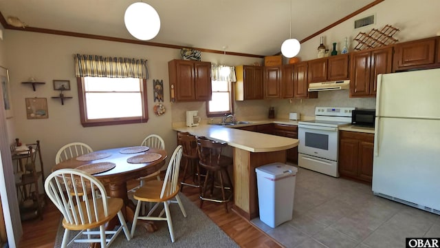1809 Apache St Lot 3, Kill Devil Hills, NC 27948 - kitchen featuring white appliances, under cabinet range hood, a peninsula, ornamental molding, and light countertops