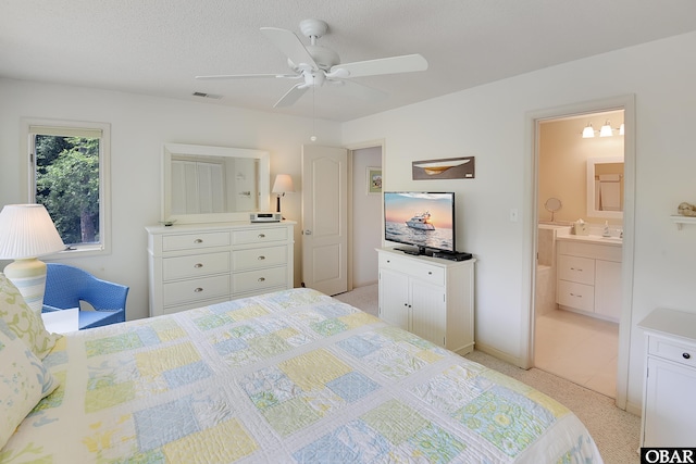 1143 Albemarle Ct Unit 681, Corolla, NC 27927 - bedroom with ensuite bathroom and ceiling fan