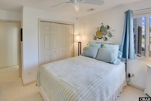 1143 Albemarle Ct Unit 681, Corolla, NC 27927 - bedroom with light colored carpet, a closet, and ceiling fan