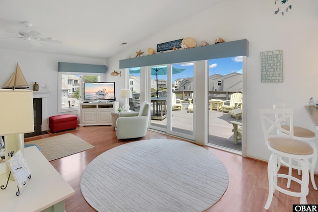 1143 Albemarle Ct Unit 681, Corolla, NC 27927 - living area with vaulted ceiling, a ceiling fan, and wood finished floors