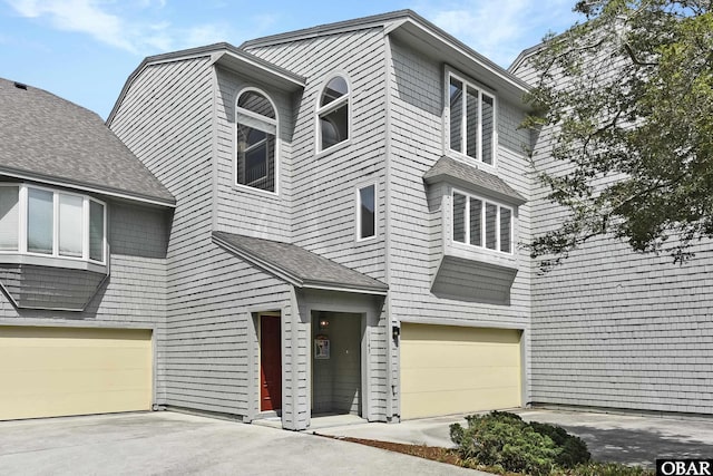 1143 Albemarle Ct Unit 681, Corolla, NC 27927 - view of front facade featuring a garage and driveway