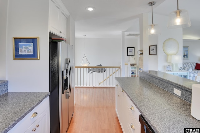 1143 Albemarle Ct Unit 681, Corolla, NC 27927 - kitchen with stainless steel refrigerator with ice dispenser, light wood-style floors, white cabinetry, open floor plan, and hanging light fixtures