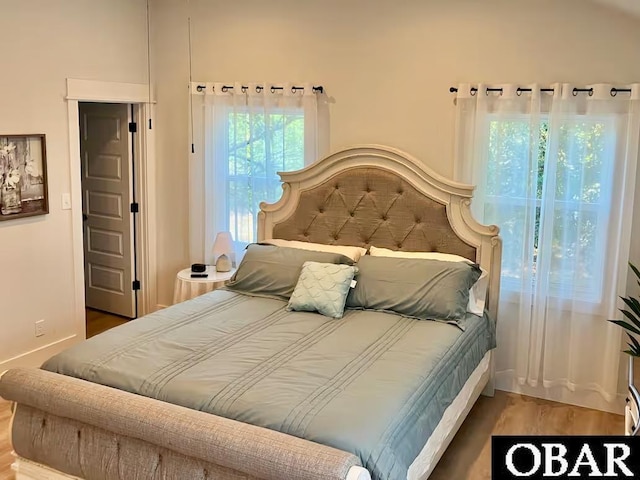 bedroom with wood finished floors