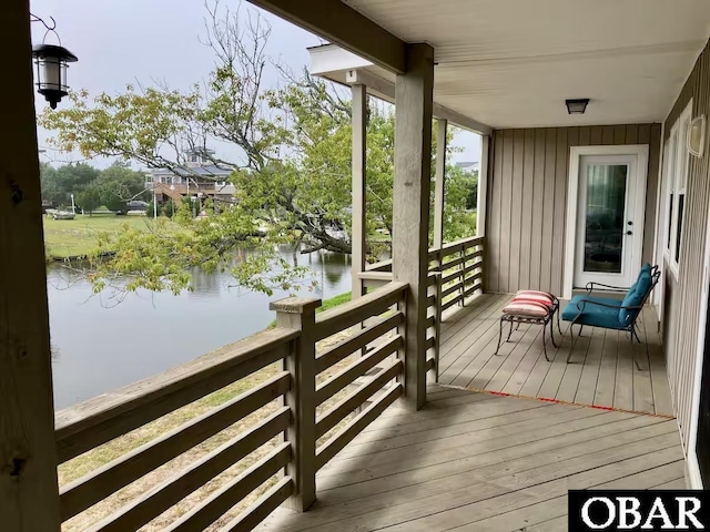 2218 Ocean Pearl Rd Lot 27, Corolla, NC 27927 - rec room featuring ornamental molding, wainscoting, wood finished floors, beamed ceiling, and ceiling fan