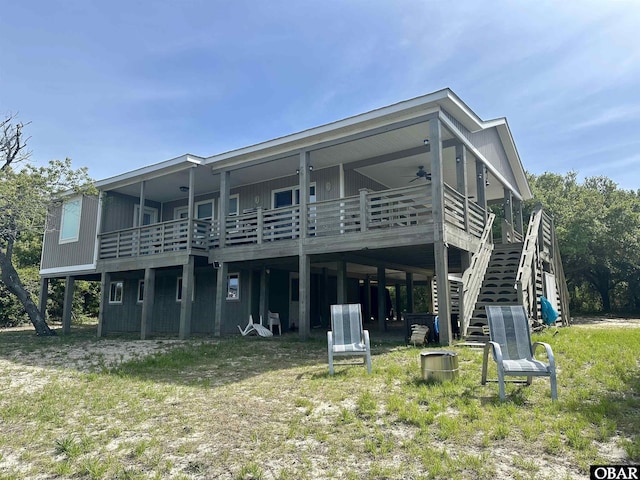 back of property with stairs, ceiling fan, and a wooden deck