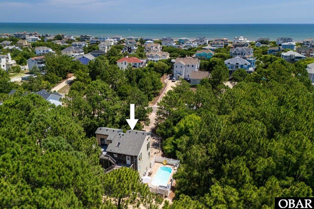 birds eye view of property with a water view and a residential view