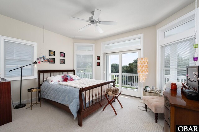 carpeted bedroom with access to outside, baseboards, and ceiling fan