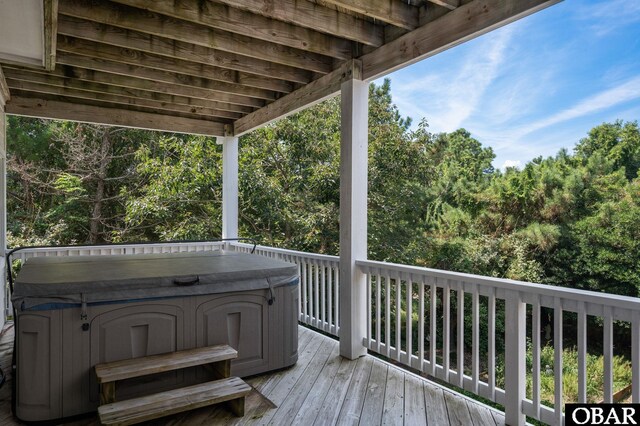 deck with a hot tub