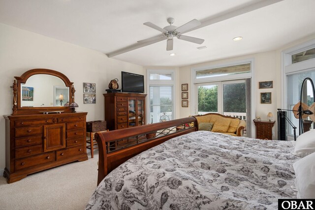 bedroom with ceiling fan, carpet, multiple windows, and access to outside