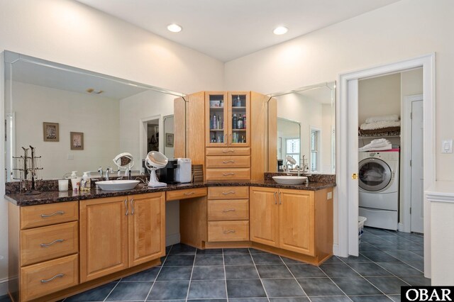 full bath with vanity, washer / dryer, and tile patterned floors