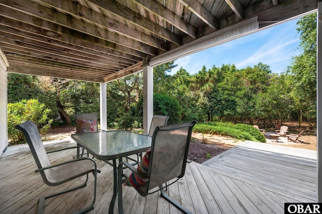 deck featuring an outdoor fire pit