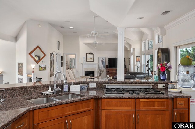 kitchen featuring open floor plan, a sink, visible vents, and stainless steel gas cooktop