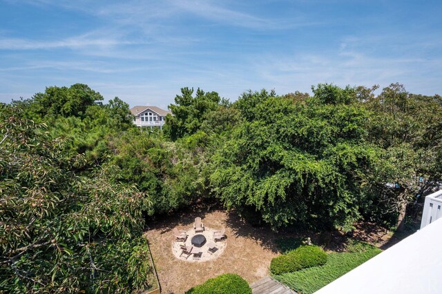 view of yard with an outdoor fire pit