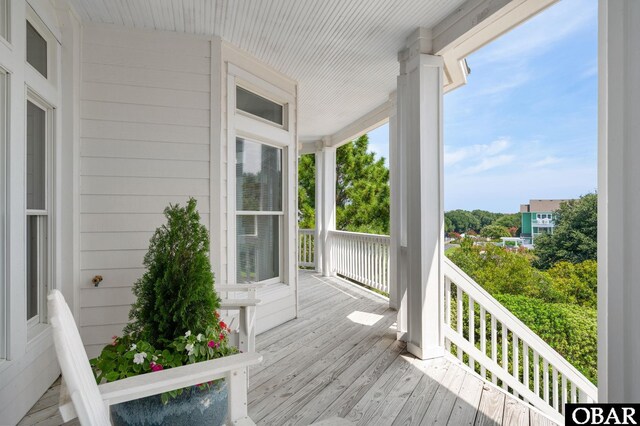 wooden terrace featuring a porch