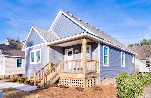 view of front of home with roof with shingles