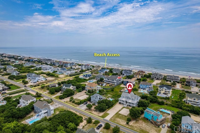 birds eye view of property with a water view and a residential view