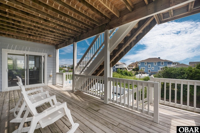 wooden deck featuring a residential view