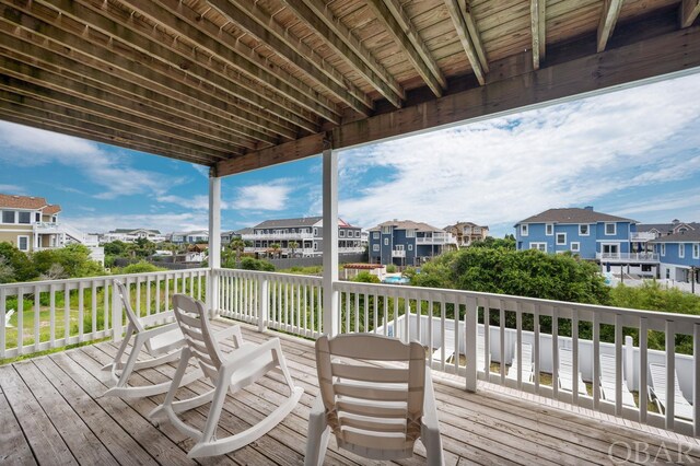 wooden deck featuring a residential view