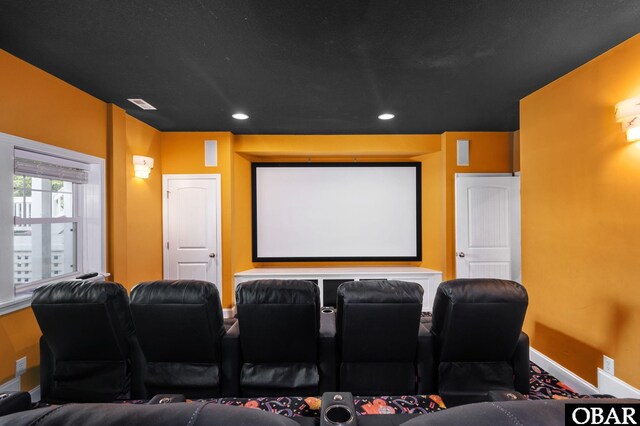 home theater room featuring baseboards, visible vents, and recessed lighting